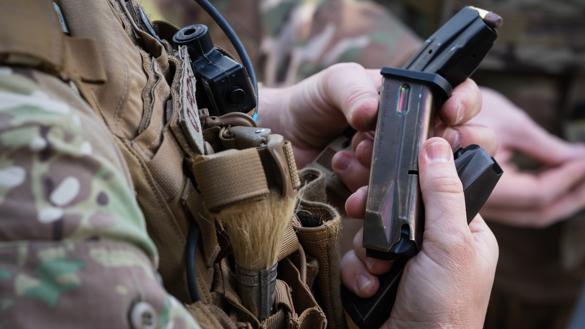 An Airman assigned to the 6th Civil Engineer Squadron explosive ordnance disposal flight loads magazines with ammunition at MacDill Air Force Base, Florida, Dec. 12, 2023.