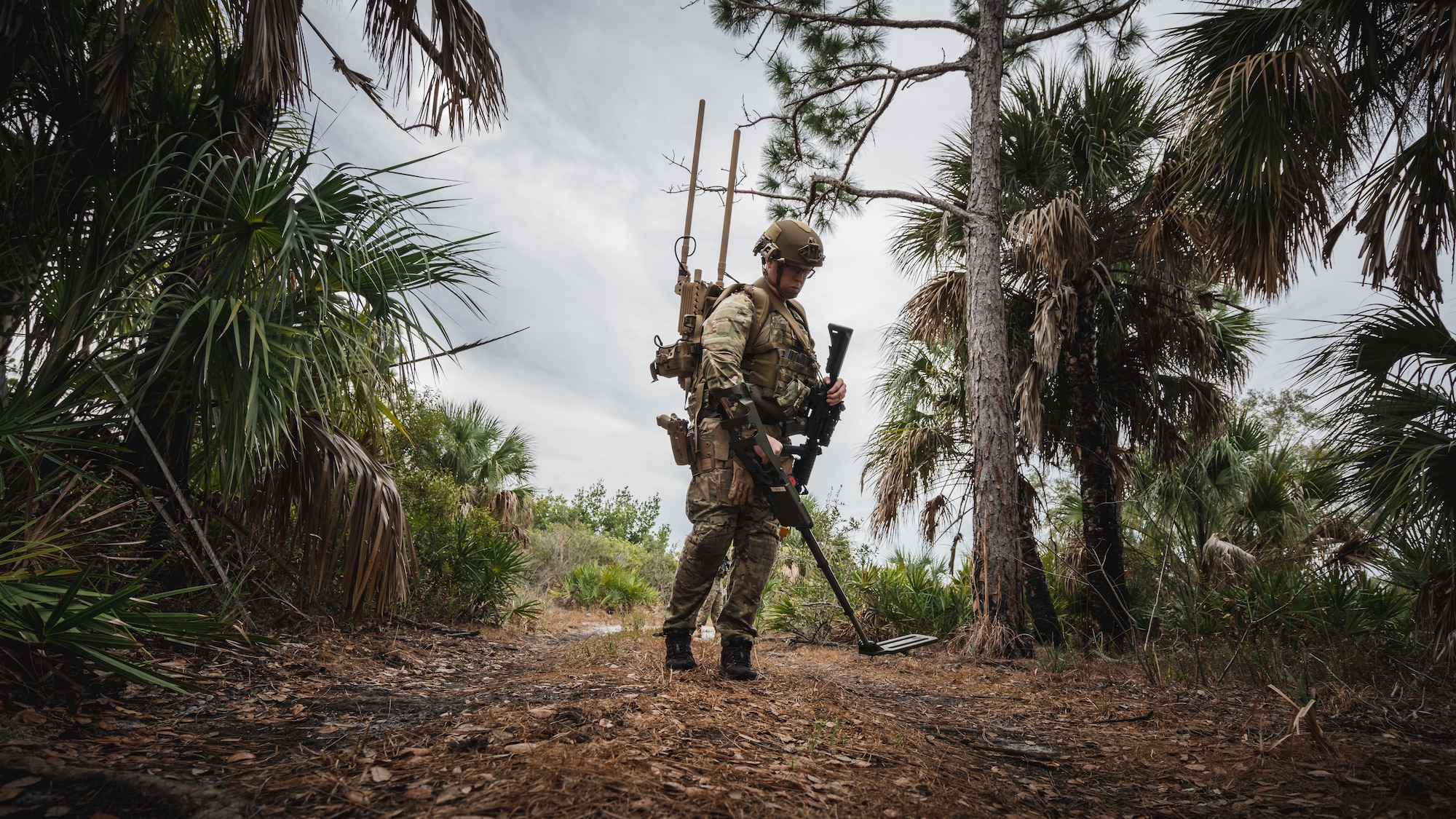 U.S. Air Force Airman 1st Class Cody Boldt, 6th Civil Engineer Squadron explosive ordnance disposal technician, searches for dangerous materials during a dismounted exercise at MacDill Air Force Base, Florida, Dec. 14, 2023.