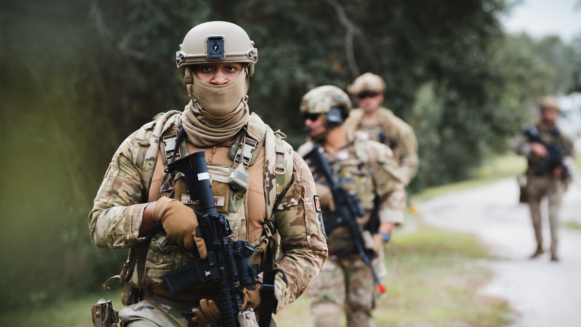 Airmen assigned to the 6th Civil Engineer Squadron explosive ordnance disposal flight and the 6th Security Forces Squadron survey the surrounding area during a dismounted exercise at MacDill Air Force Base, Florida, Dec. 14, 2023.