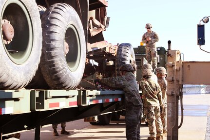 Spc. Ricardo Rios maintained constant communication with crane operator while soldiers secure the disabled vehicle. Regional training Site Maintenance – Fort Indiantown Gap, under the 94th Training Division, partnered with the 1st Brigade Combat Team 10th Mountain Division in Fort Drum, NY, to ensure 16 active-duty soldiers received the wheeled recovery specialist additional skill identifier.