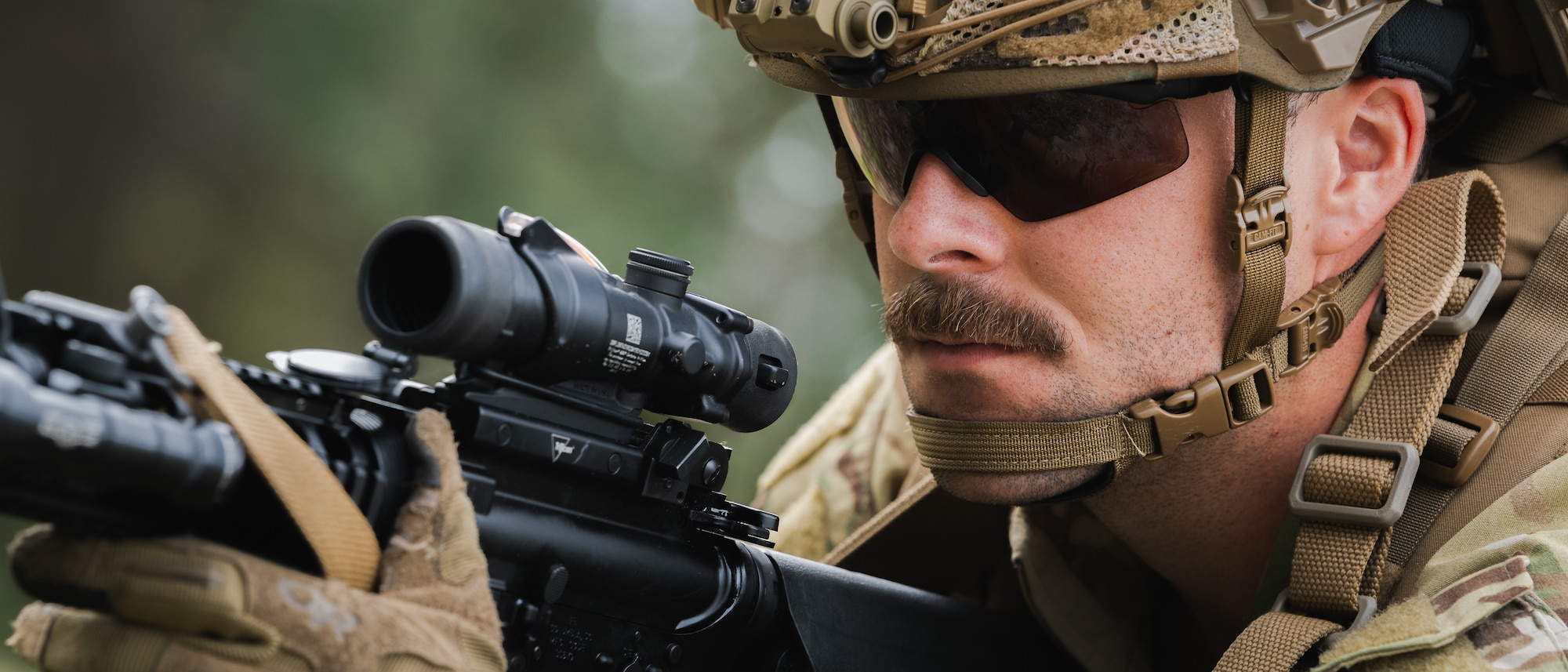 U.S. Air Force Senior Airman Alexander Kuri, 6th Civil Engineer Squadron explosive ordnance disposal technician, surveys the surrounding area during a dismounted exercise at MacDill Air Force Base, Florida, Dec. 14, 2023.