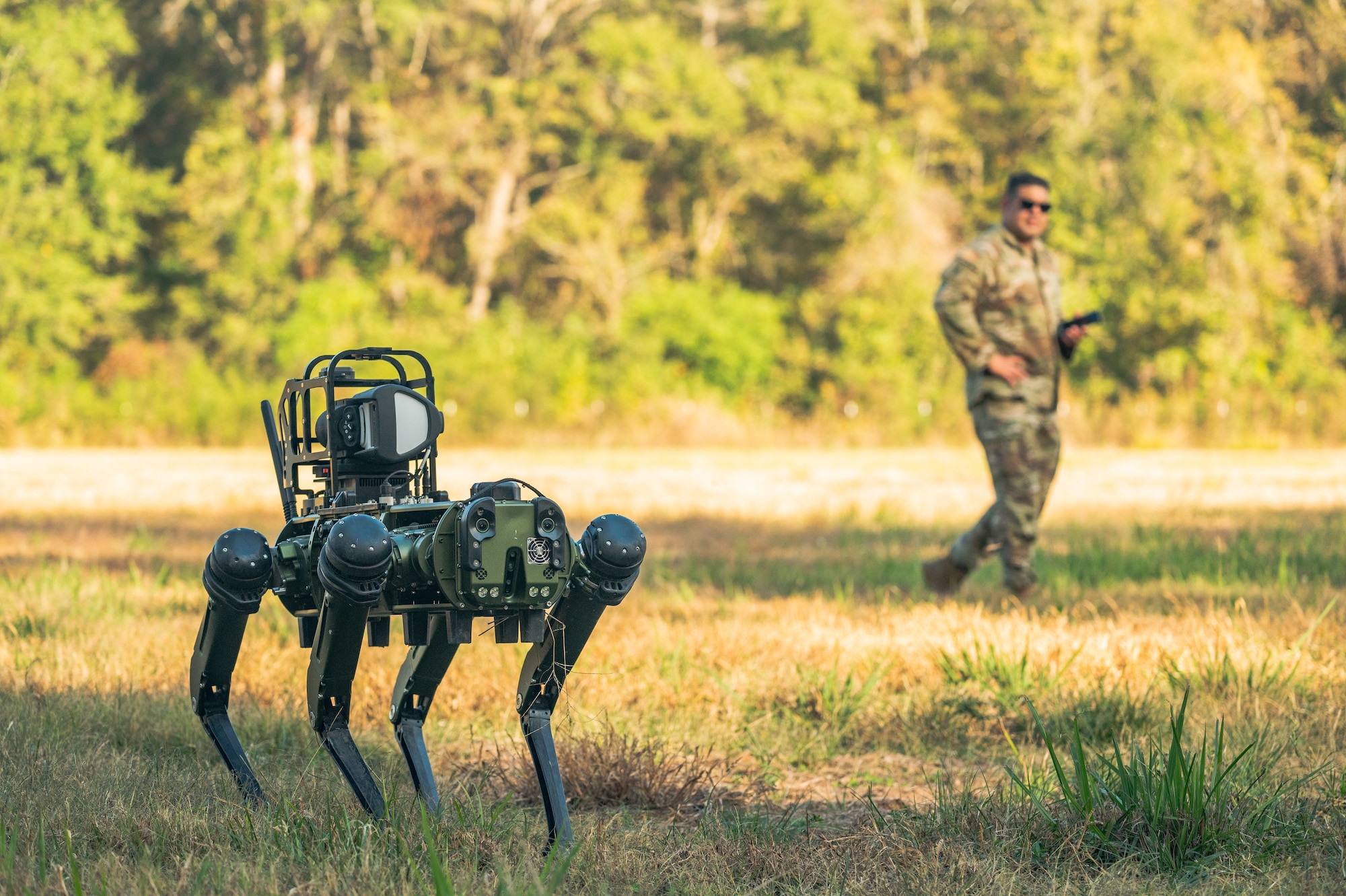 Airman waits for Robot dog