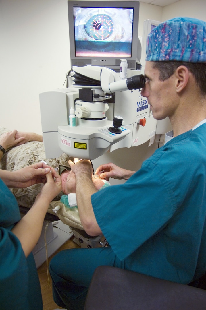 Then Navy Capt. (Dr.) Joseph Pasternak performs eye surgery at Walter Reed National Military Medical Center.