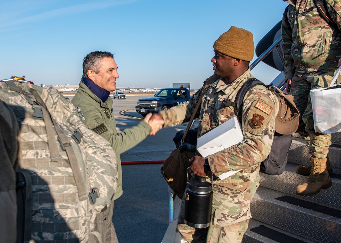 Maj. Gen. Paul Knapp, Wisconsin’s adjutant general, greets a 128th Air Refueling Wing Airman as he disembarks from a KC-135 here at General Mitchell Field, Milwaukee, WI, March 5, 2023. Airmen from the 128th ARW were assigned to the 506th Expeditionary Air Refueling Squadron as part of the U.S. Pacific Command at Andersen Air Force Base, Guam. (U.S. Air National Guard photo by Master Sgt. Kellen Kroening)