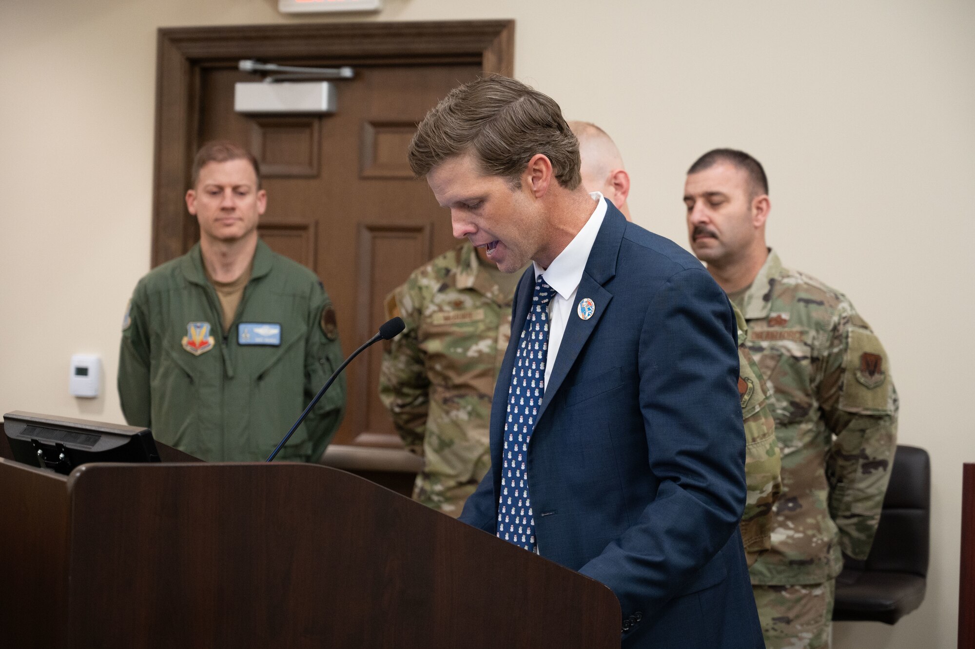 U.S. Airmen from the 114th Electromagnetic Warfare Squadron are pictured with the city of Cape Canaveral Mayor Wes Morrison during a city council meeting held Dec. 19, 2023. The mayor declared Jan. 14, 2024 as '114th EWS Day' in honor of the contributions made by its members, their continued involvement in the community, and their commitment to protecting and defending the values and interests of local residents, and all U.S. citizens. The 114th EWS is a geographically-separated unit of the Florida Air National Guard's 125th Fighter Squadron located at Cape Canaveral Space Force Station. Their mission is to organize, train and equip personnel to conduct electromagnetic attacks in contested, congested and constrained environments downrange, using specialized equipment such as the counter communications system. Previously, the unit operated as the 114th Space Control Squadron before it was redesignated as an electromagnetic squadron in January 2023. (U.S. Air National Guard photo by Tech Sgt. Chelsea Smith)