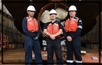 From left to right, Chief Petty Officer Brian Dove, Petty Officer 2nd Class Mason Couch, and Petty Officer 2nd Class Craig Bennett pose for a photo in Dutch Harbor, Alaska, June 24, 2023. MSD Dutch Harbor will soon be a stand-alone Marine Safety Unit (MSU) as a part to expand junior command opportunities to different communities. U.S. Coast Guard photo by Petty Officer 3rd Class Ian Gray.