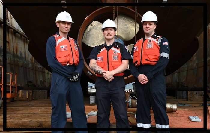 From left to right, Chief Petty Officer Brian Dove, Petty Officer 2nd Class Mason Couch, and Petty Officer 2nd Class Craig Bennett pose for a photo in Dutch Harbor, Alaska, June 24, 2023. MSD Dutch Harbor will soon be a stand-alone Marine Safety Unit (MSU) as a part to expand junior command opportunities to different communities. U.S. Coast Guard photo by Petty Officer 3rd Class Ian Gray.