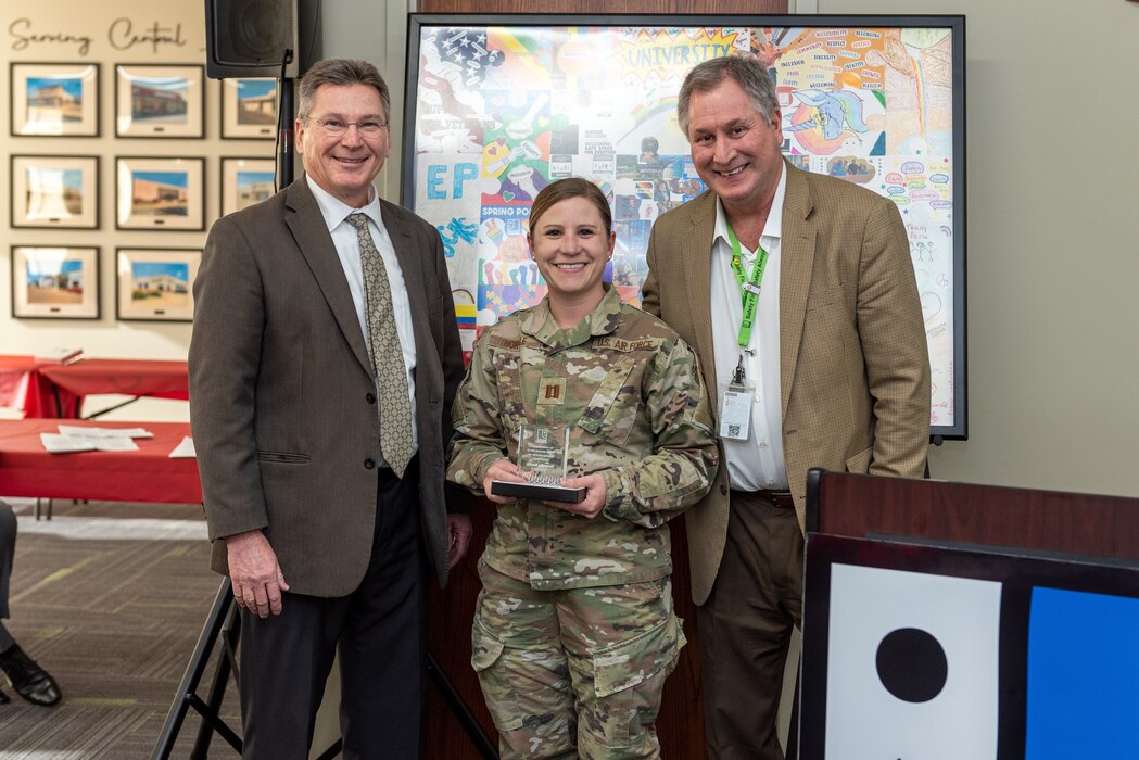 Airman receiving award.