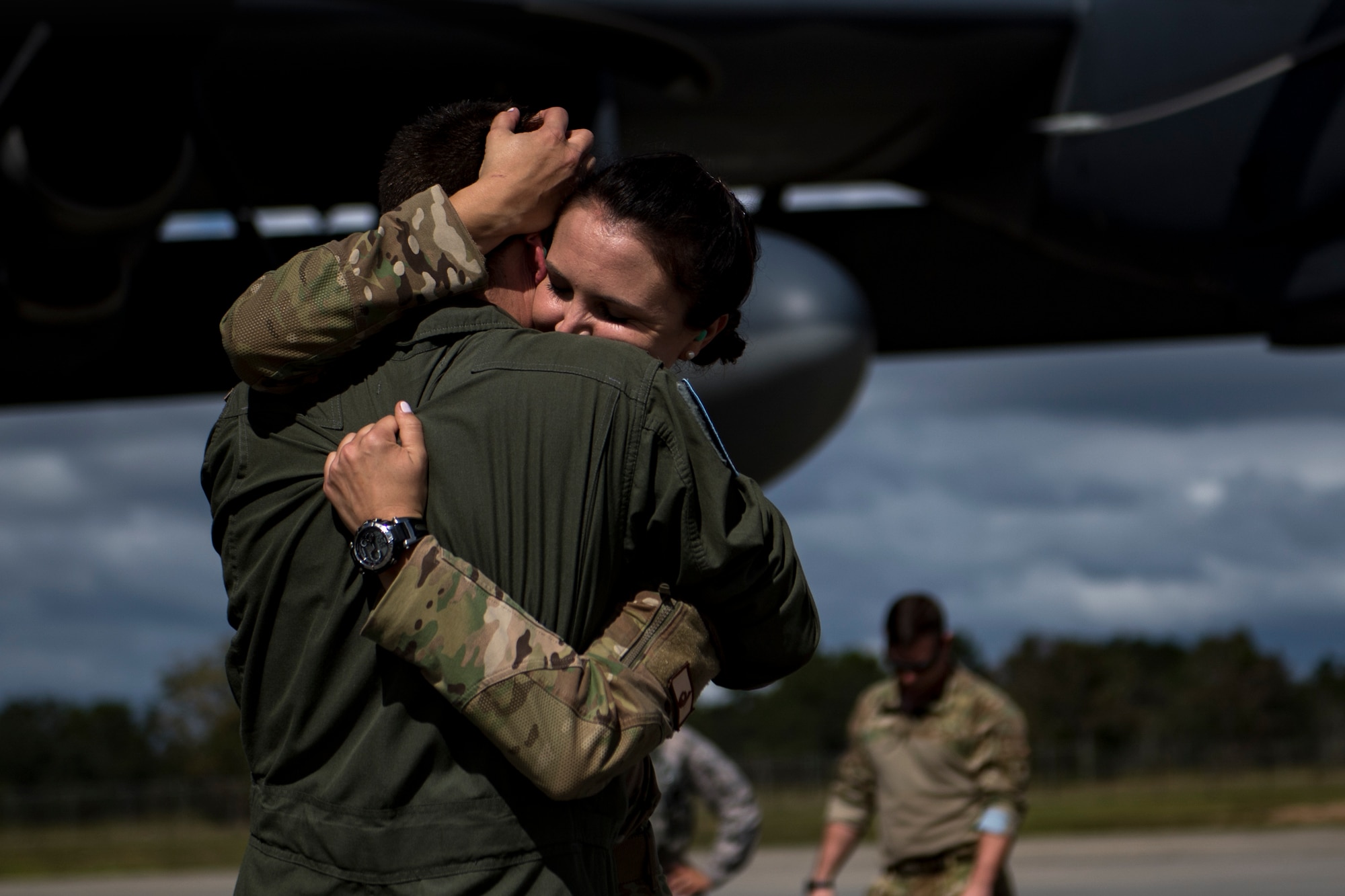 Two people hugging.