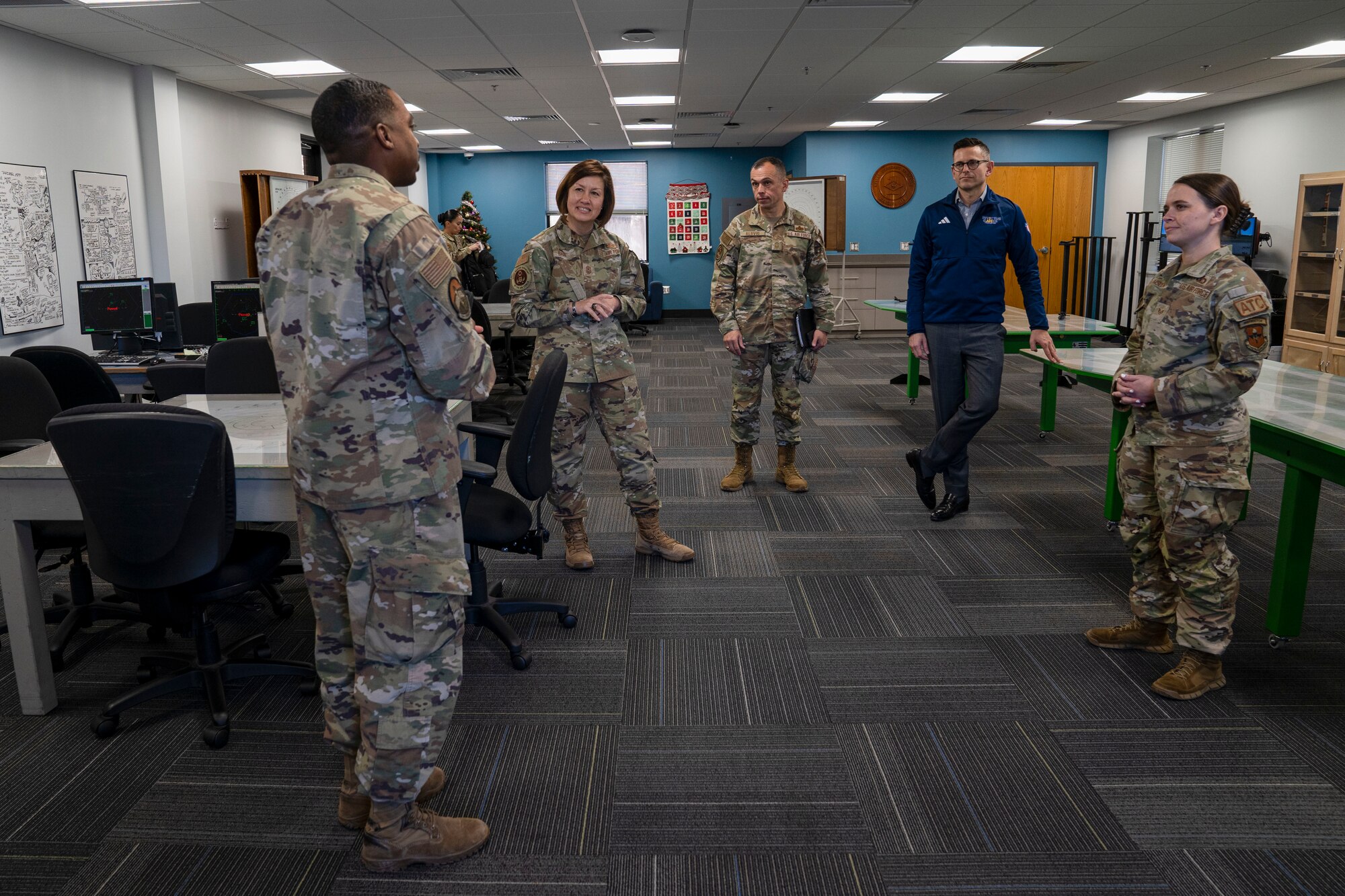 Chief Master Sgt. of the Air Force JoAnne S. Bass and the Honorable Alex Wagner, Assistant Secretary of the Air Force for Manpower and Reserve Affairs, and Chief Master Sgt. John Alsvig, Air Force First Sergeant Special Duty manager, learn about the new Air Traffic Control study room on Keesler Air Force Base, Mississippi, Dec. 19, 2023.