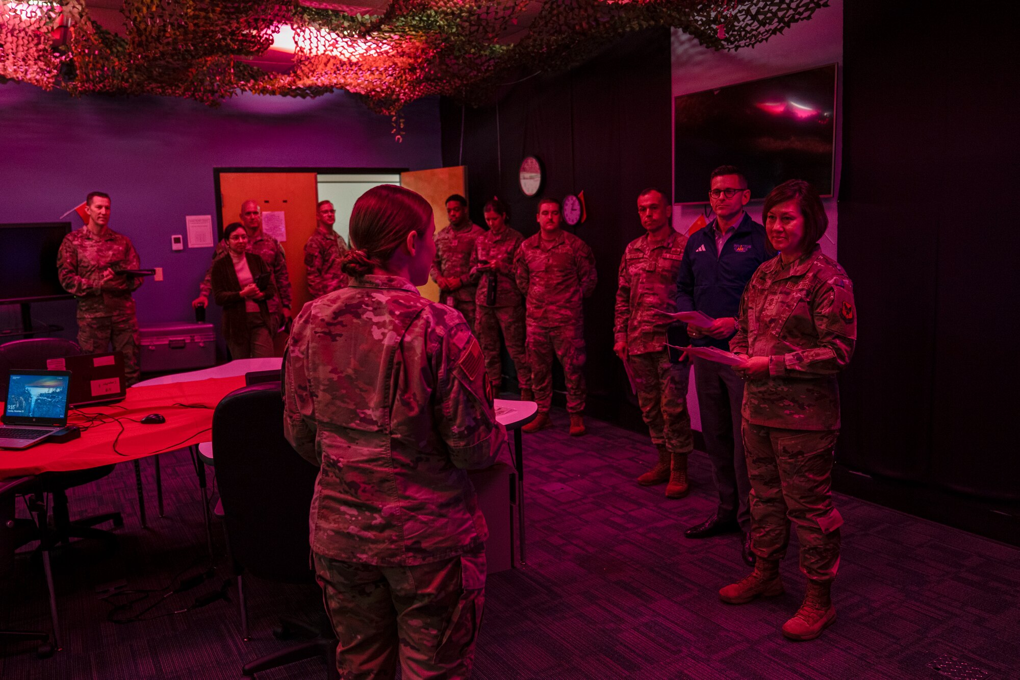 Chief Master Sgt. of the Air Force JoAnne S. Bass, the Honorable Alex Wagner, Assistant Secretary of the Air Force for Manpower and Reserve Affairs, and Chief Master Sgt. John Alsvig, Air Force First Sergeant Special Duty manager, learn about the 333rd Training Squadron Cyber Escape Room on Keesler Air Force Base, Mississippi, Dec. 19, 2023.