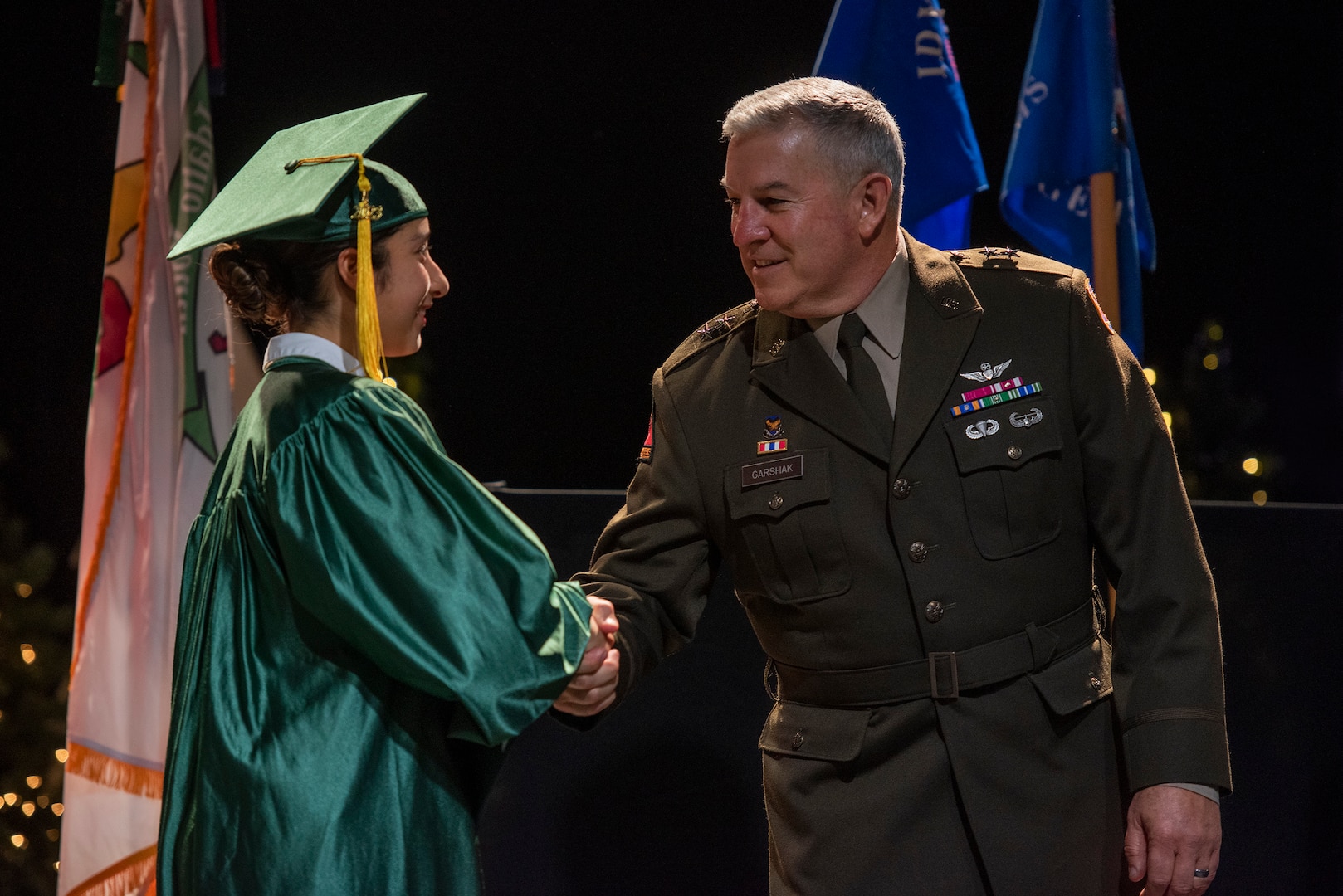 Maj. Gen. Michael Garshak, the adjutant general of Idaho and commander of the Idaho National Guard, congratulates one of 120 high school students who graduated from the Idaho Youth ChalleNGe Academy Dec. 16, 2023, in Boise, Idaho. The Department of Defense program provides second chances to at-risk teens.