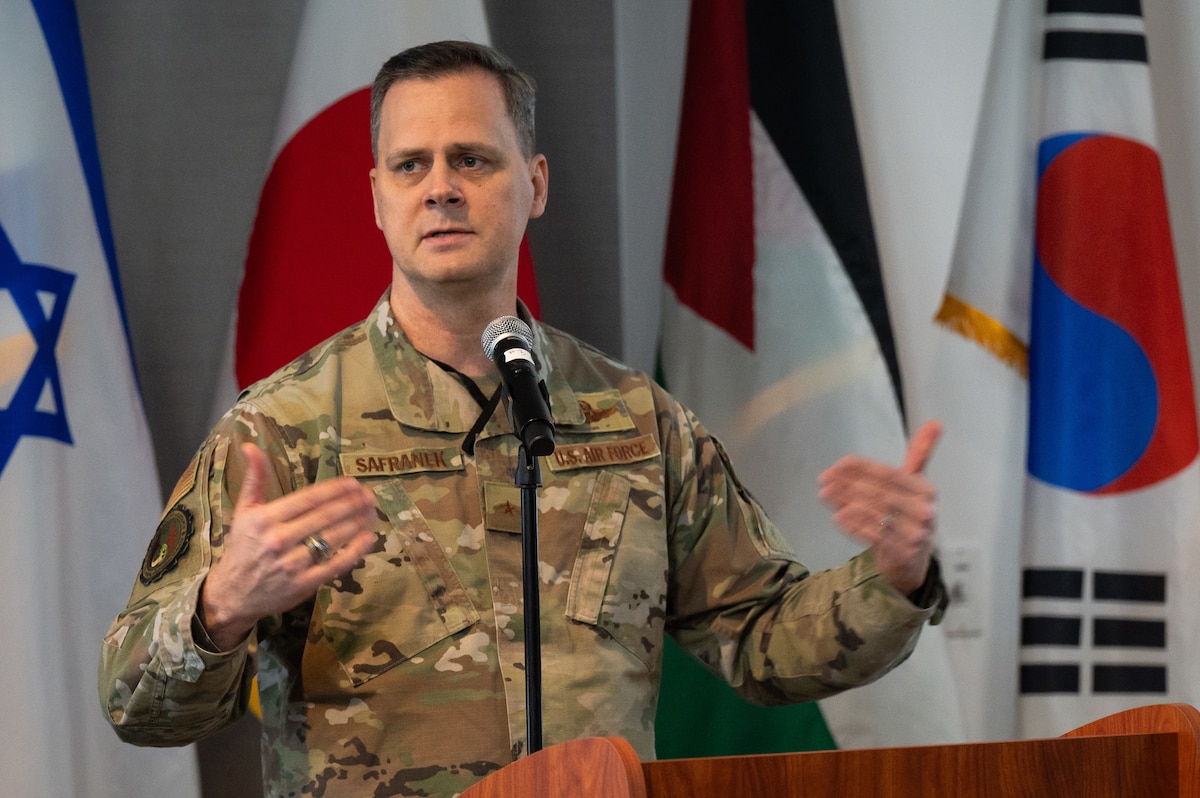 Brig Gen Joel Safranek speaks at podium.
