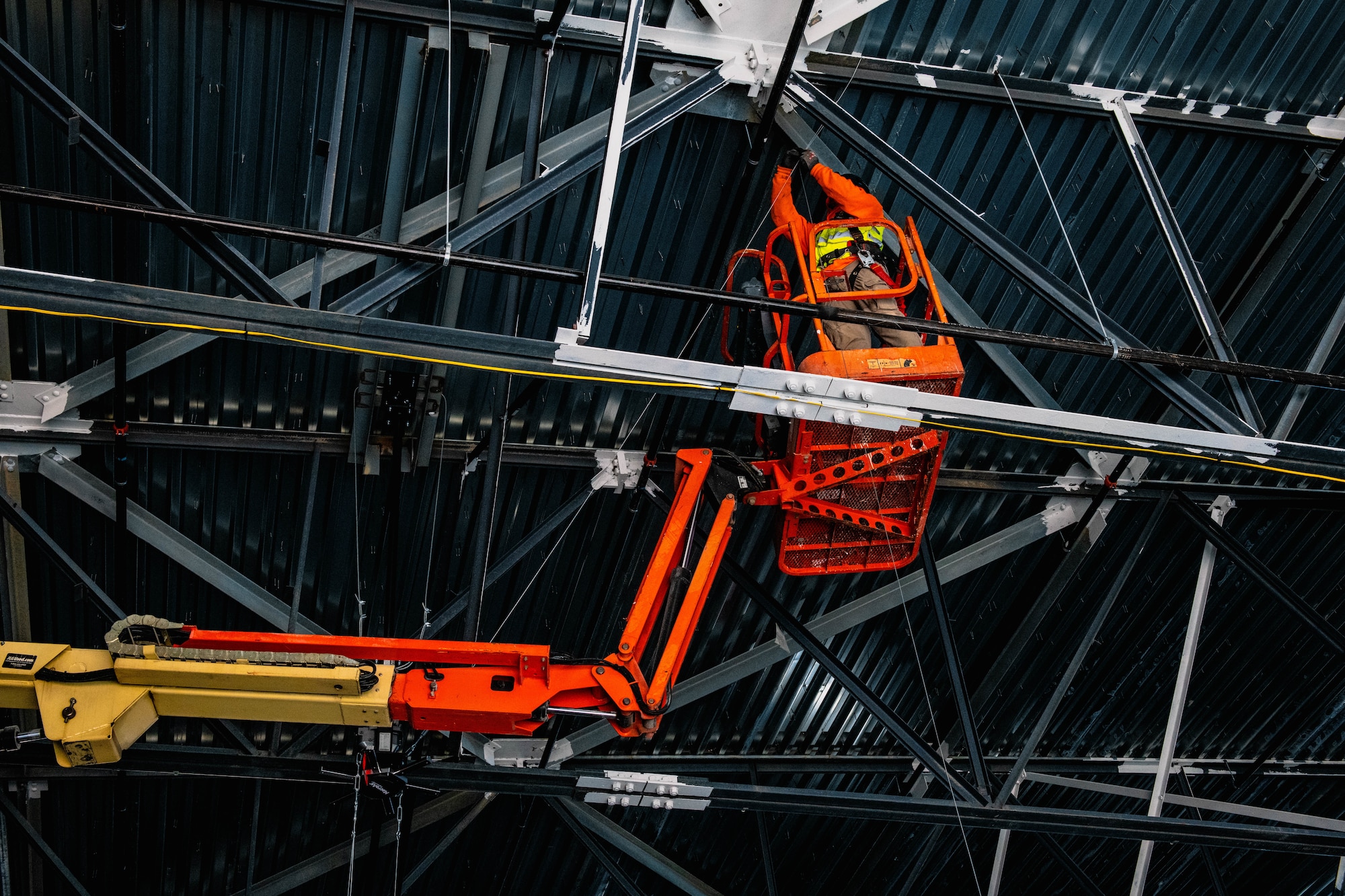 Construction worker on a cherry picker.