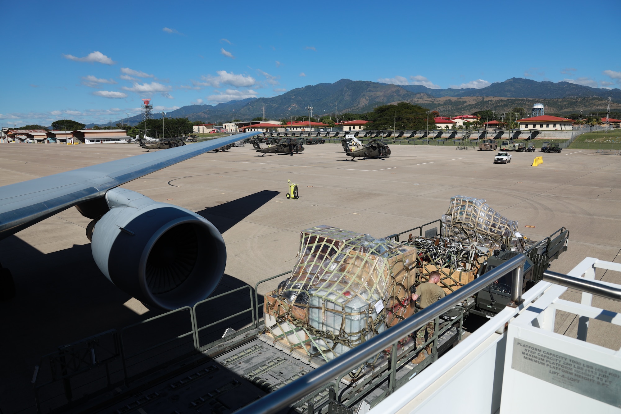 Pallets of a cargo delivery to Honduras are transported to the flightline Dec. 3. 2023.