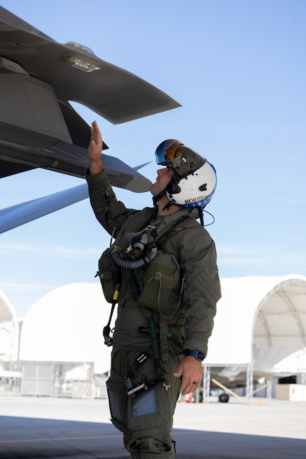 U.S. Marine Corps Maj. Andrew Bonell, an F-35B Lightning II pilot with Marine Fighter Attack Squadron (VMFA) 214, Marine Aircraft Group 13, 3rd Marine Aircraft Wing, conducts preflight checks on an F-35B Lightning II aircraft before suppression of enemy air defense training during Exercise Steel Knight 23.2 at Marine Corps Air Station Yuma, Arizona, Dec. 5, 2023. SEAD training increases the ability of fifth-generation fighter pilots to enter the fight first, strike targets deep within an enemy air defense system, and enable follow on strikes by supporting weapons platforms. Steel Knight 23.2 is a three-phase exercise designed to train I Marine Expeditionary Force in the planning, deployment and command and control of a joint force against a peer or near-peer adversary combat force and enhance existing live-fire and maneuver capabilities of the Marine Air-Ground Task Force. (U.S. Marine Corps photo by Cpl. Jade K. Venegas)