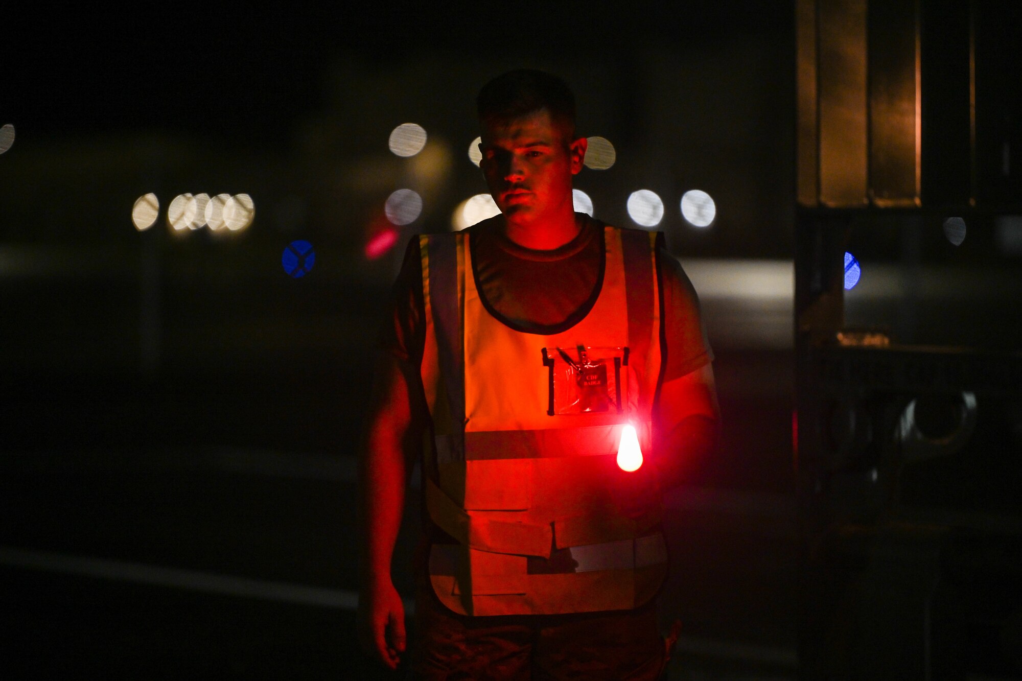 2nd. Lt. Shane Fillion, 647th Logistics Readiness Squadron, cargo deployment functional officer, directs a forklift, carrying cargo, onto a K-loader during the Readiness Exercise 24-01 at Joint Base Pearl Harbor-Hickam, Hawaii, Dec. 13, 2023. The 15th Wing trains to operate, fight and advance its capabilities through realistic training exercises designed to test and develop joint logistics, resilience and rapid strategic mobility. (U.S. Air Force photo by Senior Airman Makensie Cooper)