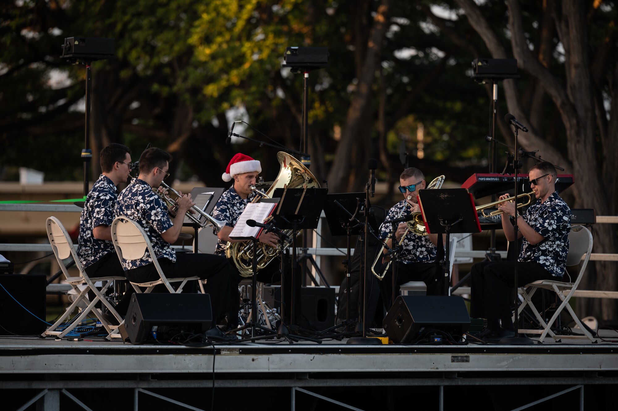 U.S. Air Force Band of the Pacific plays music during the Freedom Tower Lighting Celebration at Joint Base Pearl Harbor-Hickam, Hawaii, Dec. 15, 2023. Leadership, service members and their families celebrated the start of the holiday season during the 54th Annual tower lighting. (U.S. Air Force photo by Staff Sgt. Alan Ricker)