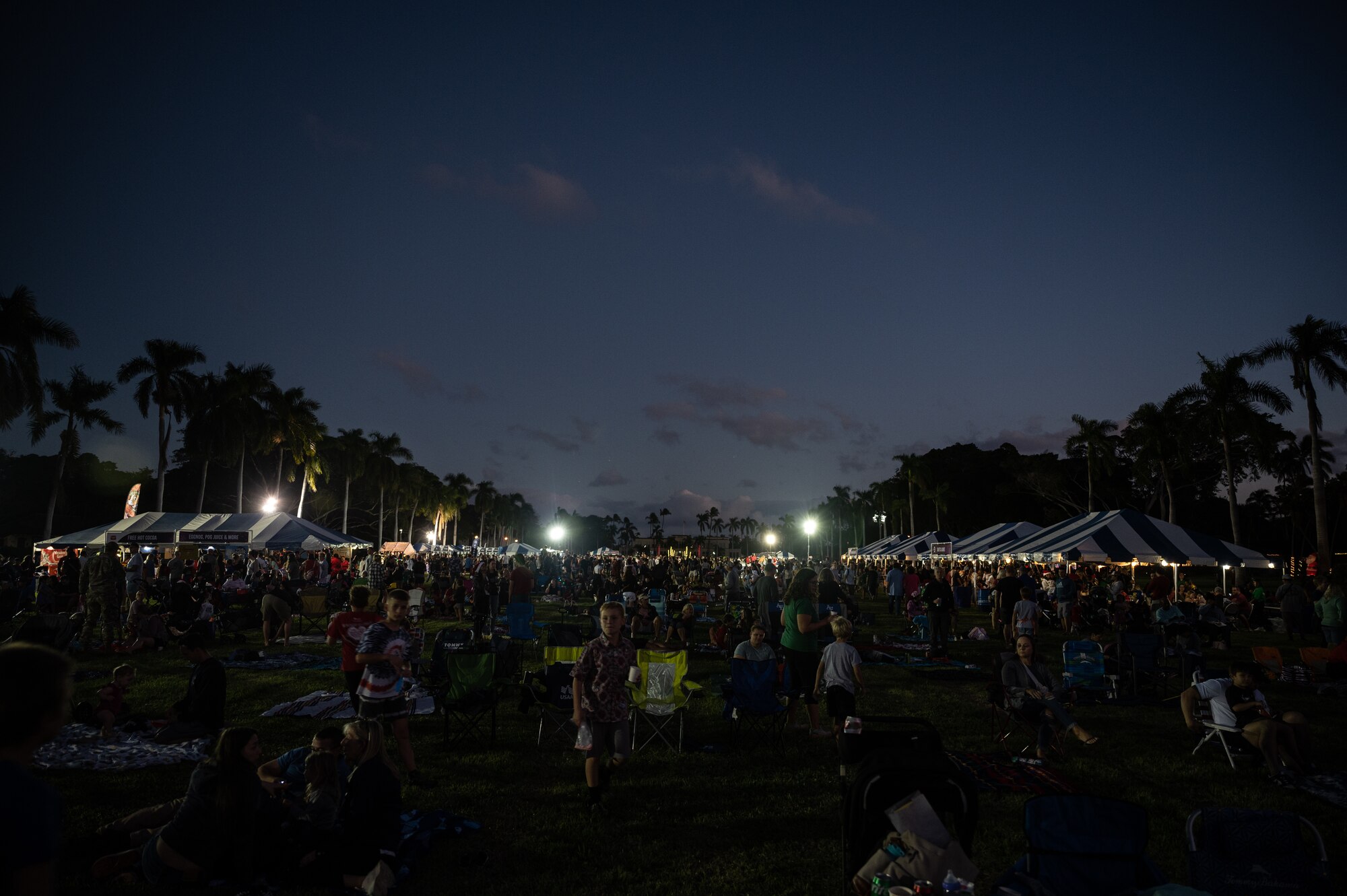 Service members and their families celebrate the start of the holiday season during the Freedom Tower Lighting Celebration at Joint Base Pearl Harbor-Hickam Hawaii, Dec. 15, 2023. Leadership, service members and their families celebrated the start of the holiday season during the 54th Annual tower lighting. (U.S. Air Force photo by Staff Sgt. Alan Ricker)