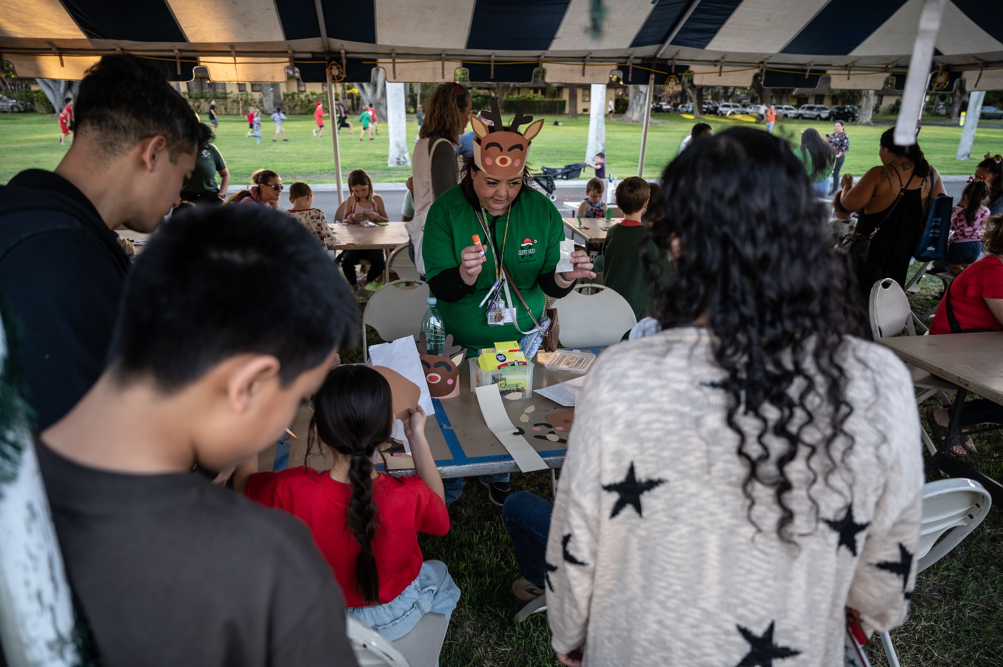 Service members and their families celebrate the start of the holiday season during the Freedom Tower Lighting Celebration at Joint Base Pearl Harbor-Hickam Hawaii, Dec. 15, 2023. Leadership from JBPHH, service members and their families celebrated the start of the holiday season during the 54th Annual tower lighting. (U.S. Air Force photo by Staff Sgt. Alan Ricker)