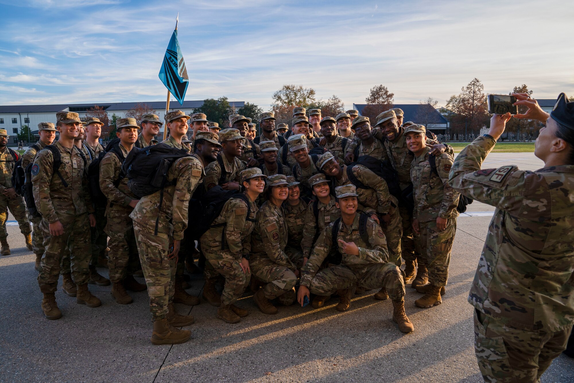 Chief Master Sgt. of the Air Force JoAnne S. Bass poses for a photo with student Airmen on Keesler Air Force Base, Mississippi, Dec. 19, 2023.