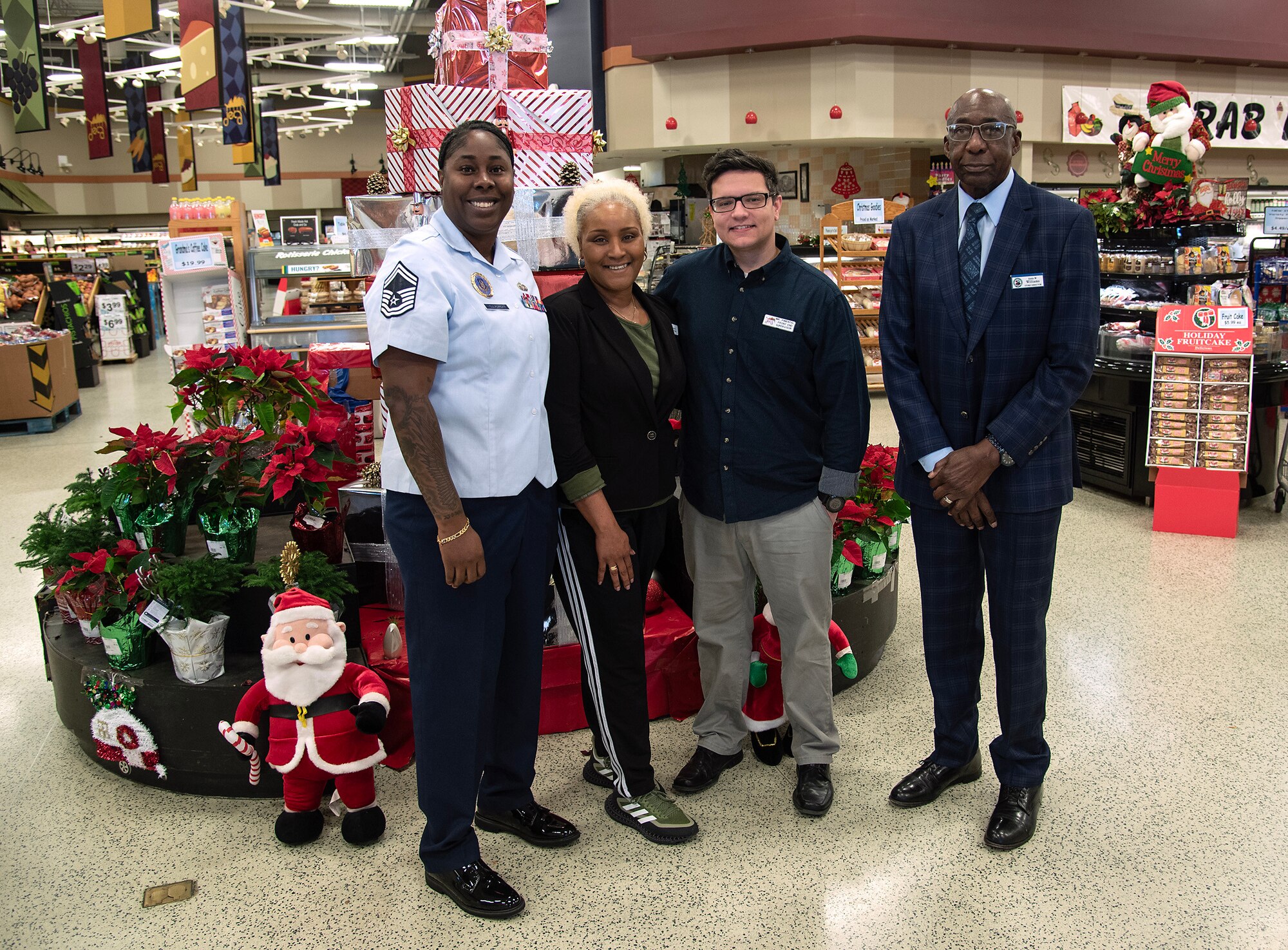 315 AW recruiters help spread holiday cheer at commissary