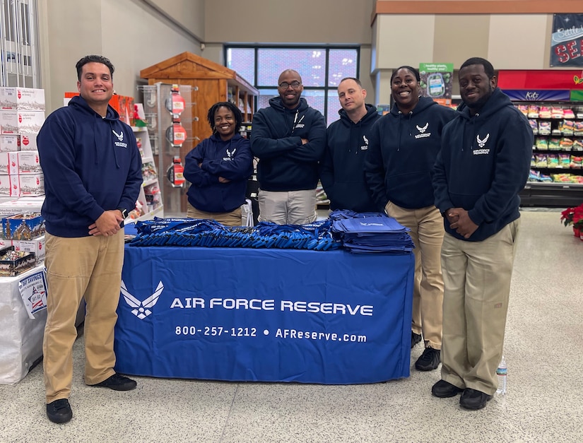 315 AW recruiters help spread holiday cheer at commissary