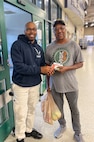 315 AW recruiters help spread holiday cheer at commissary