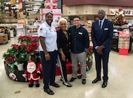 315 AW recruiters help spread holiday cheer at commissary