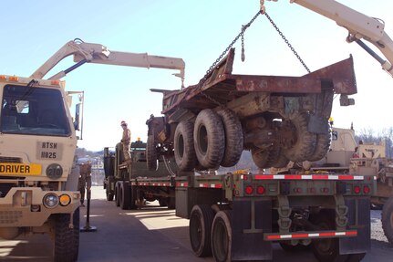 Dual cranes are used to recover a completely disabled vehicle. Regional training Site Maintenance – Fort Indiantown Gap, under the 94th Training Division, partnered with the 1st Brigade Combat Team 10th Mountain Division in Fort Drum, NY, to ensure 16 active-duty soldiers received the wheeled recovery specialist additional skill identifier.