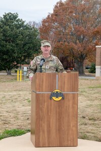 Maj. Gen. Ring standing at podium talking to audience.