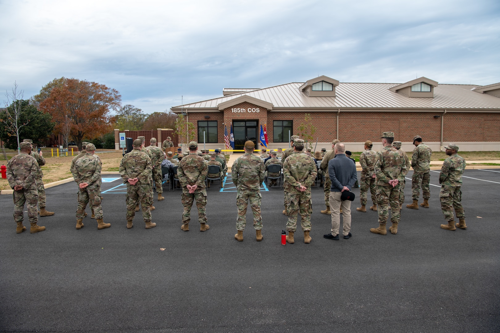 Group of people standing outside building.