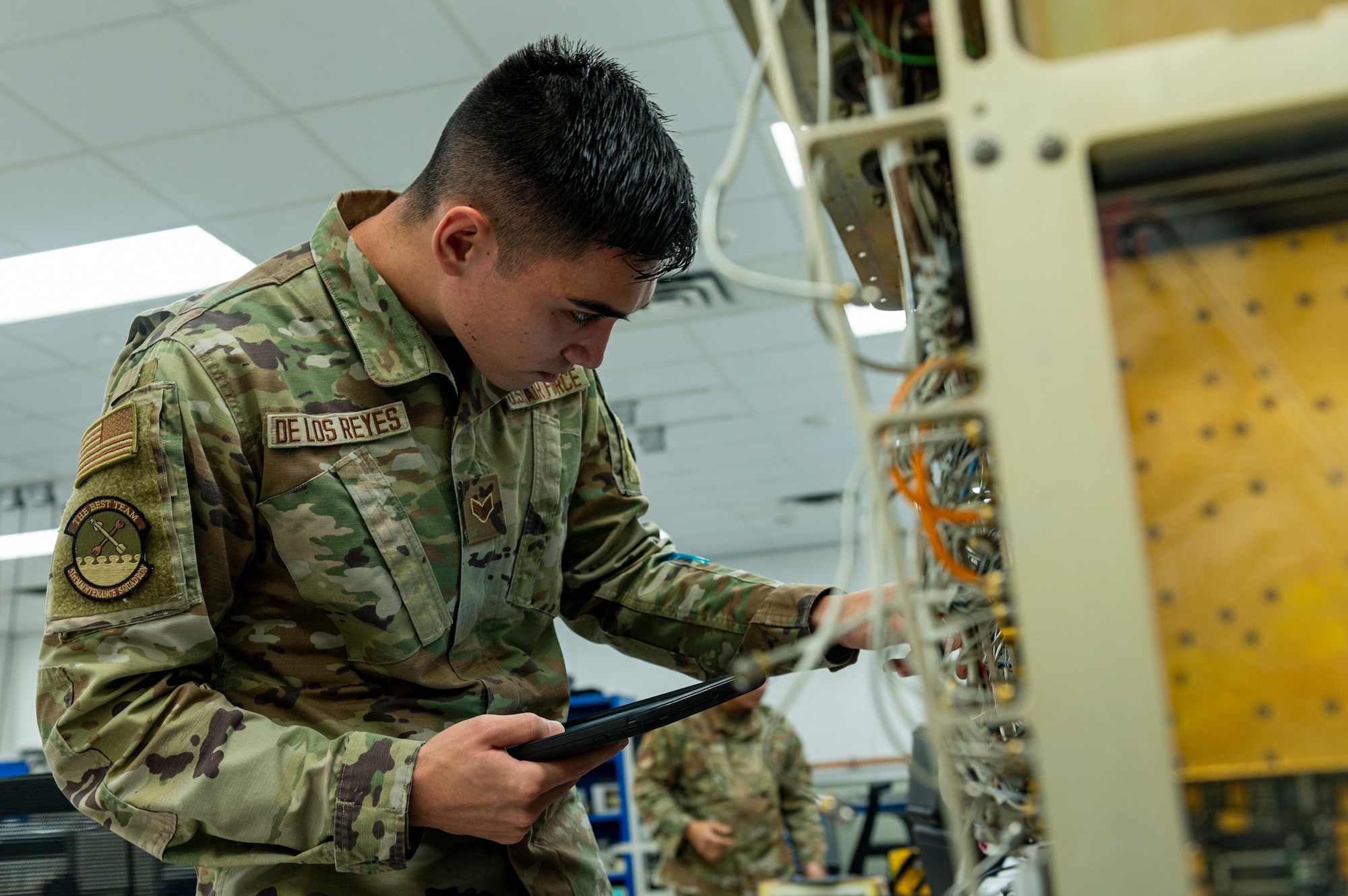 U.S. Air Force Senior Airman Bryant De Los Reyes, 51st Maintenance Squadron precision measurement equipment laboratory logistics technician, changes out a circuit in a joint service electronic combat systems tester at Osan Air Base, Republic of Korea, Dec. 15, 2023. The tester is used for radar threat warning systems on an F-16 Fighting Falcon. (U.S. Air Force photo by Senior Airman Kaitlin Castillo)