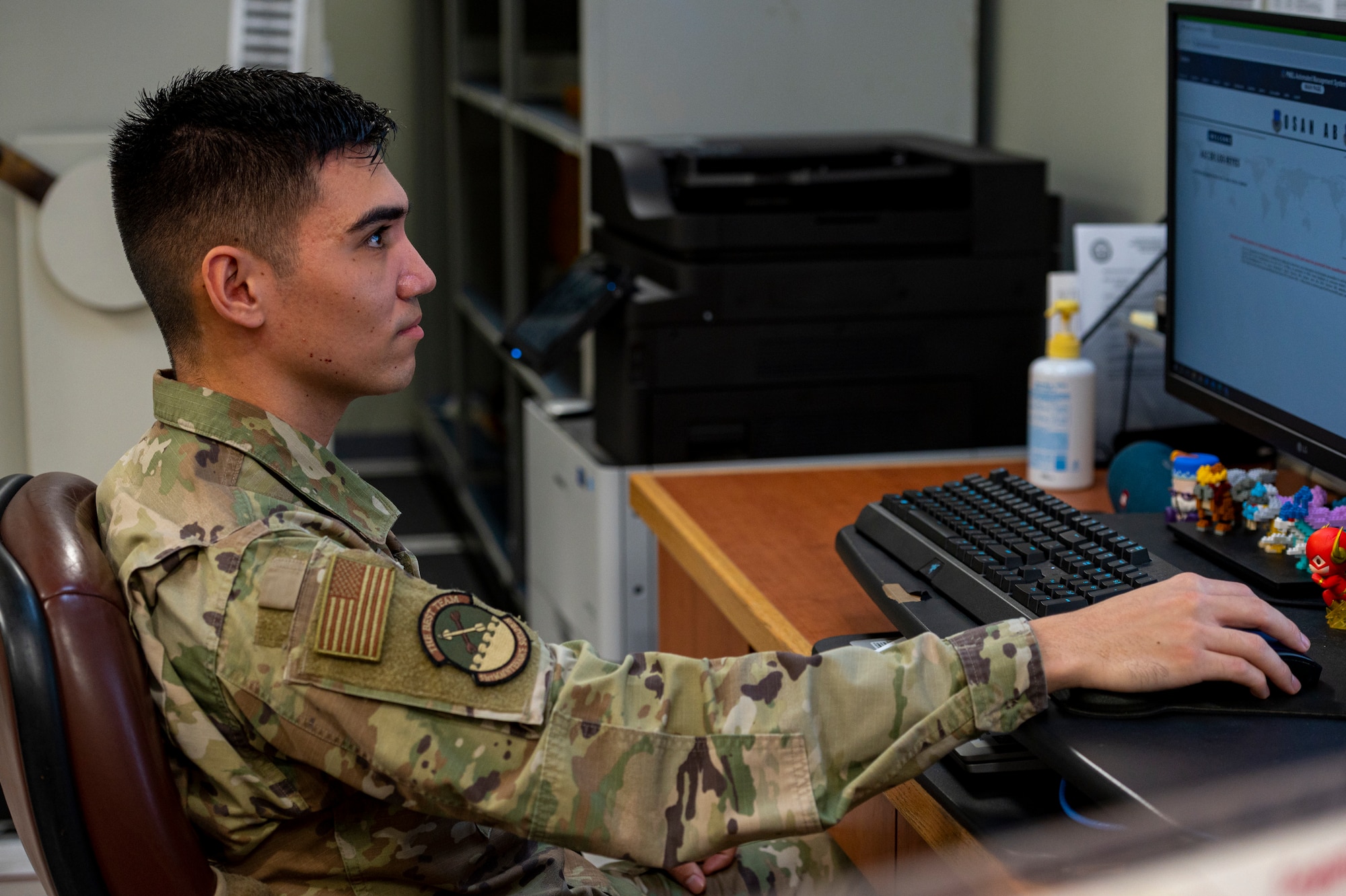 U.S. Air Force Senior Airman Bryant De Los Reyes, 51st Maintenance Squadron precision measurement equipment laboratory logistics technician, works on his computer at Osan Air Base, Republic of Korea, Dec. 15, 2023. De Los Reyes categorizes equipment by highest priority, allowing critical equipment to be calibrated and sent back to the customer in a timely manner. (U.S. Air Force photo by Senior Airman Kaitlin Castillo)