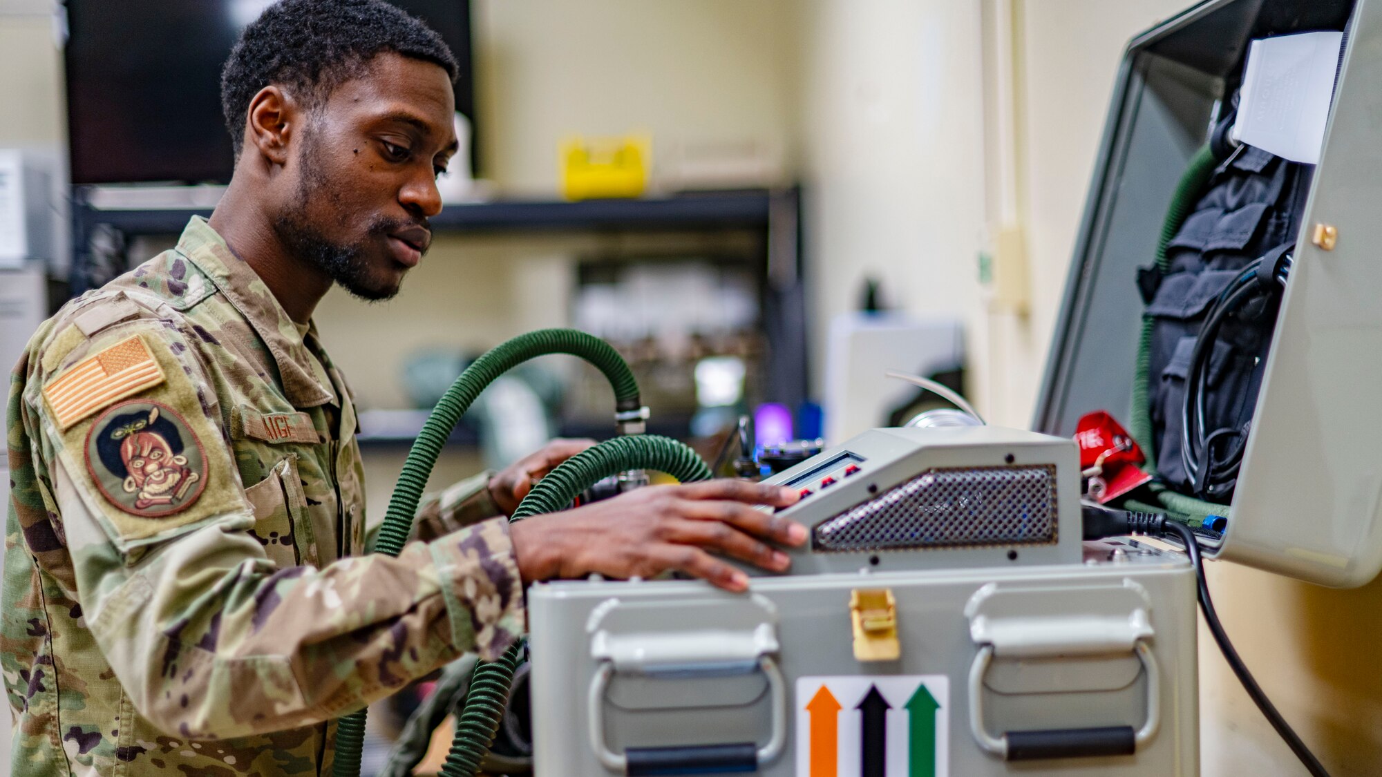 SrA Jamarius Paige, aircrew flight equipment journeyman, identifies potential leaks on a g-suit during a routine inspection at Kunsan Air Base