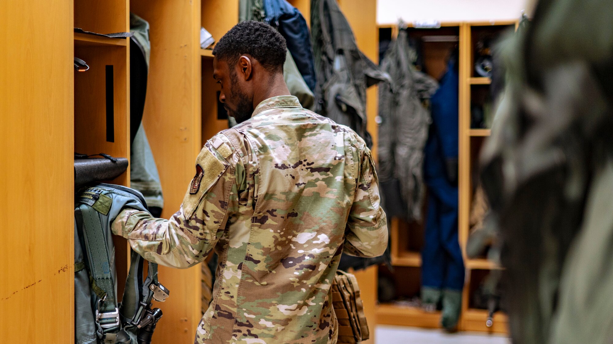 SrA Jamarius Paige, aircrew flight equipment journeyman, organizes flight equipment at Kunsan Air Base