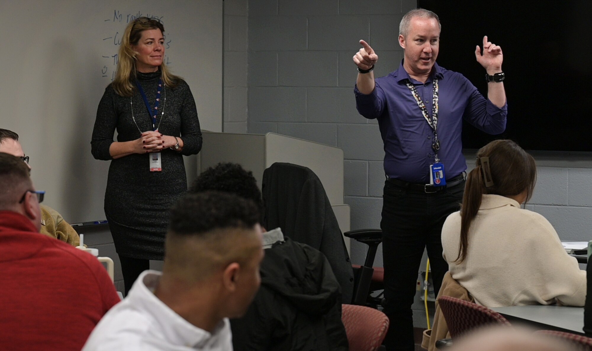 Instructor briefs classroom.