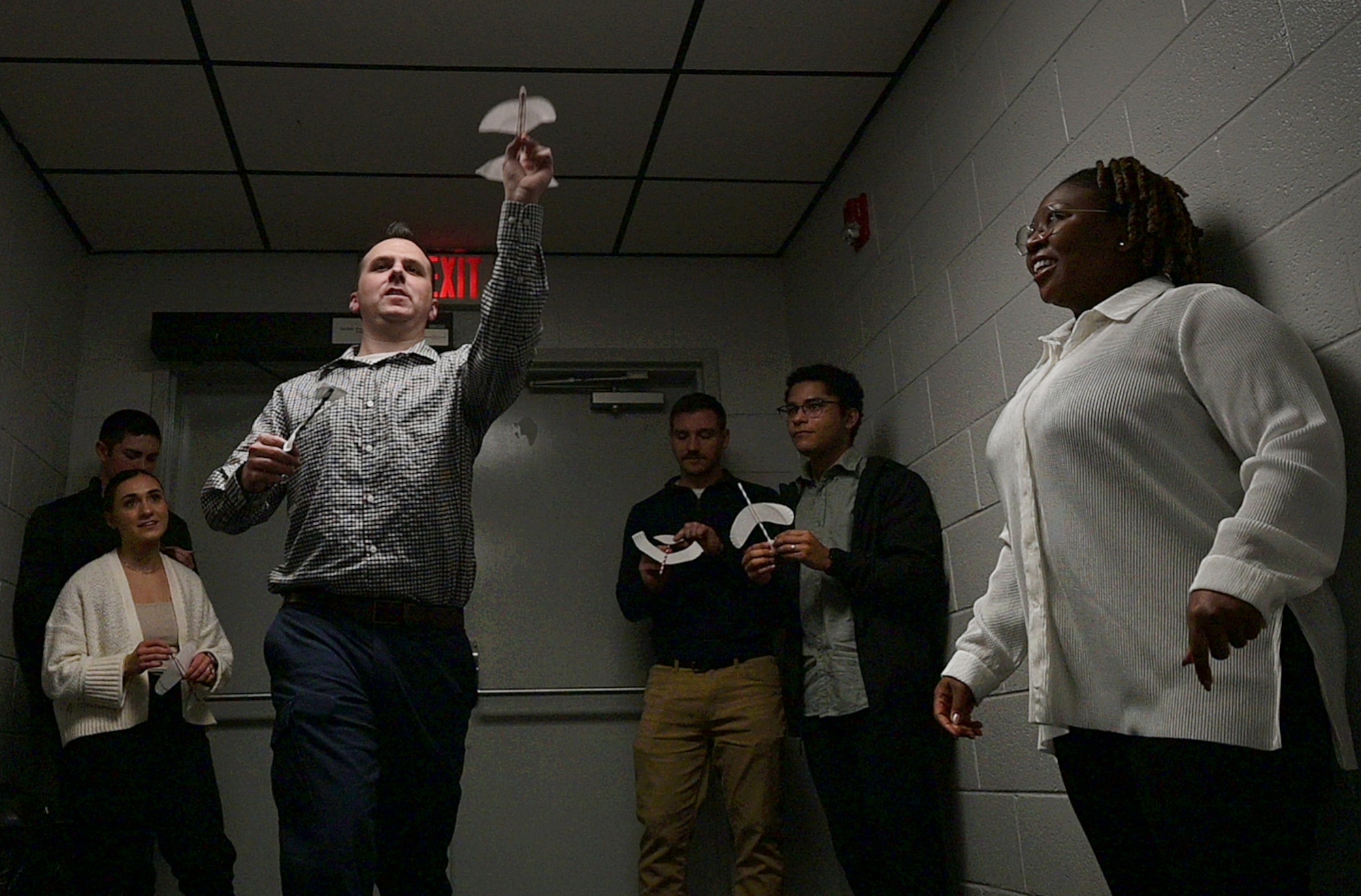 Man flies paper plane.
