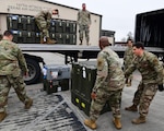 Members of the 147th Attack Wing Aircraft Maintenance Squadron unload a Block 5 MQ-9 Reaper at Ellington Field Joint Reserve Base in Houston, Texas, Dec. 21, 2023. The Block 5 Reaper will ensure the wing remains a formidable force in the ever-changing landscape of modern warfare.