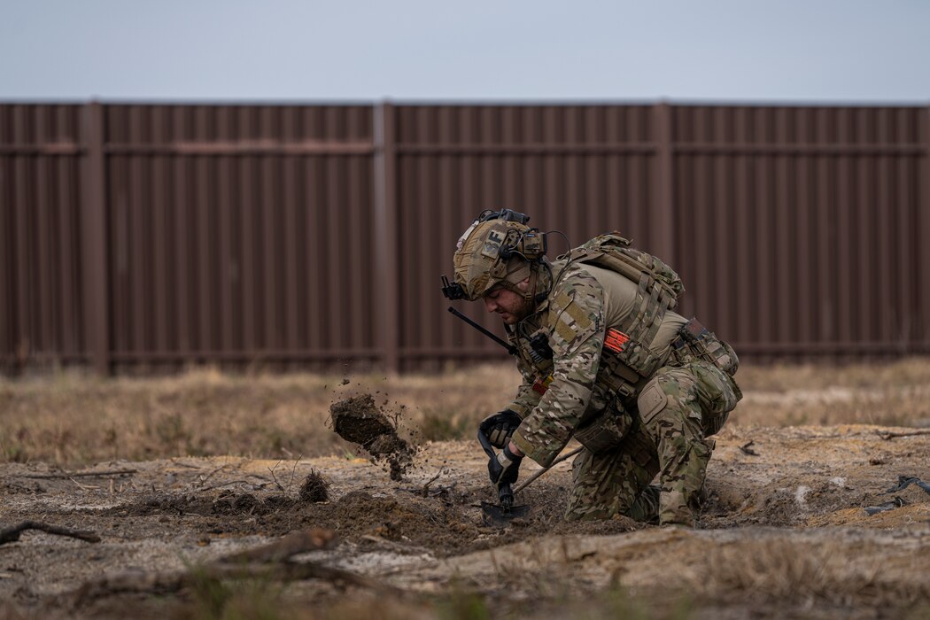 U.S. Air Force Staff Sgt. Brandon Redden, 823d Base Defense Squadron fire team member, digs a defensive fighting position