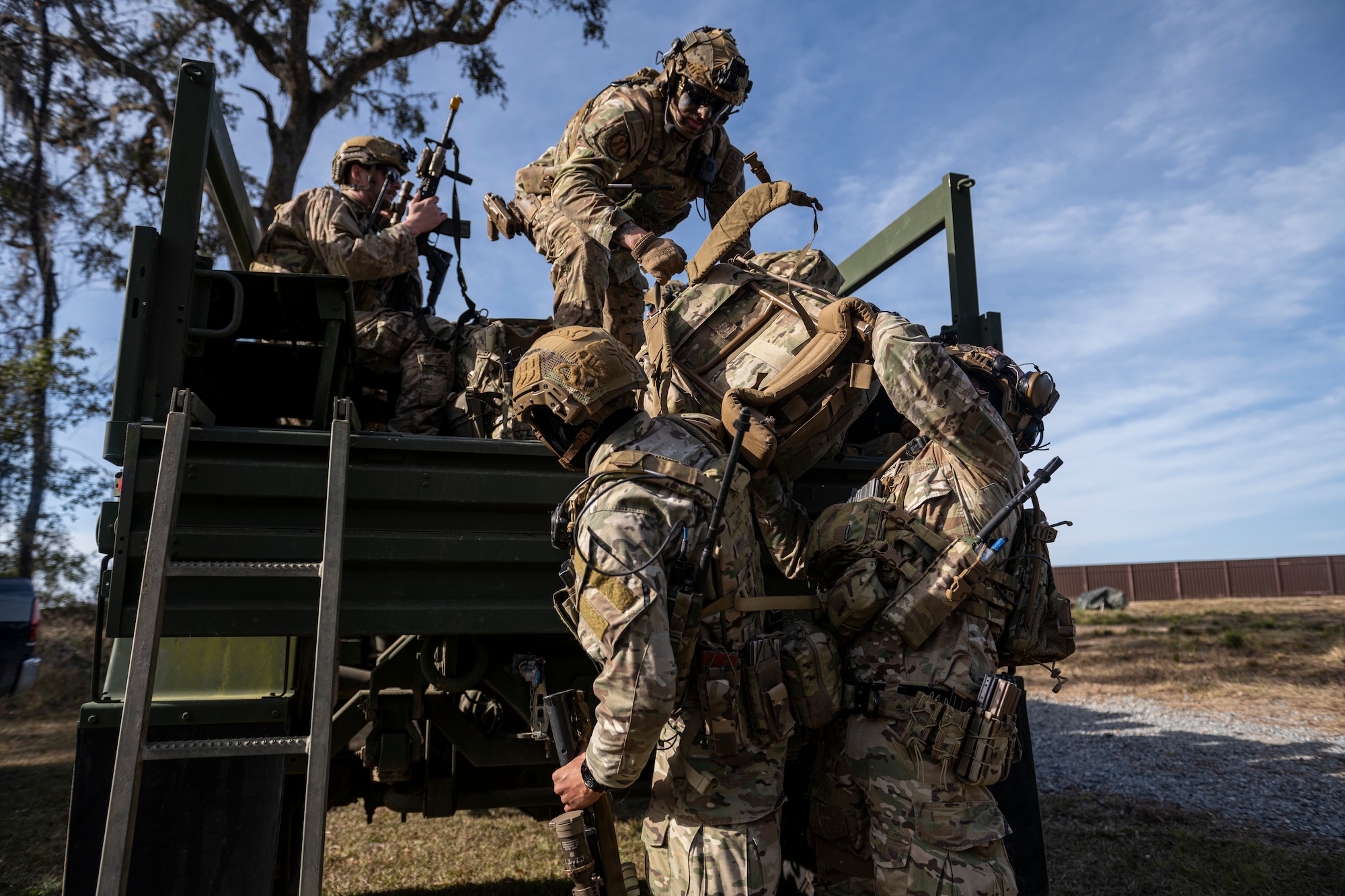 U.S. Air Force Tactical Leader Course students load into a Light Medium Tactical Vehicle during a field training exercise