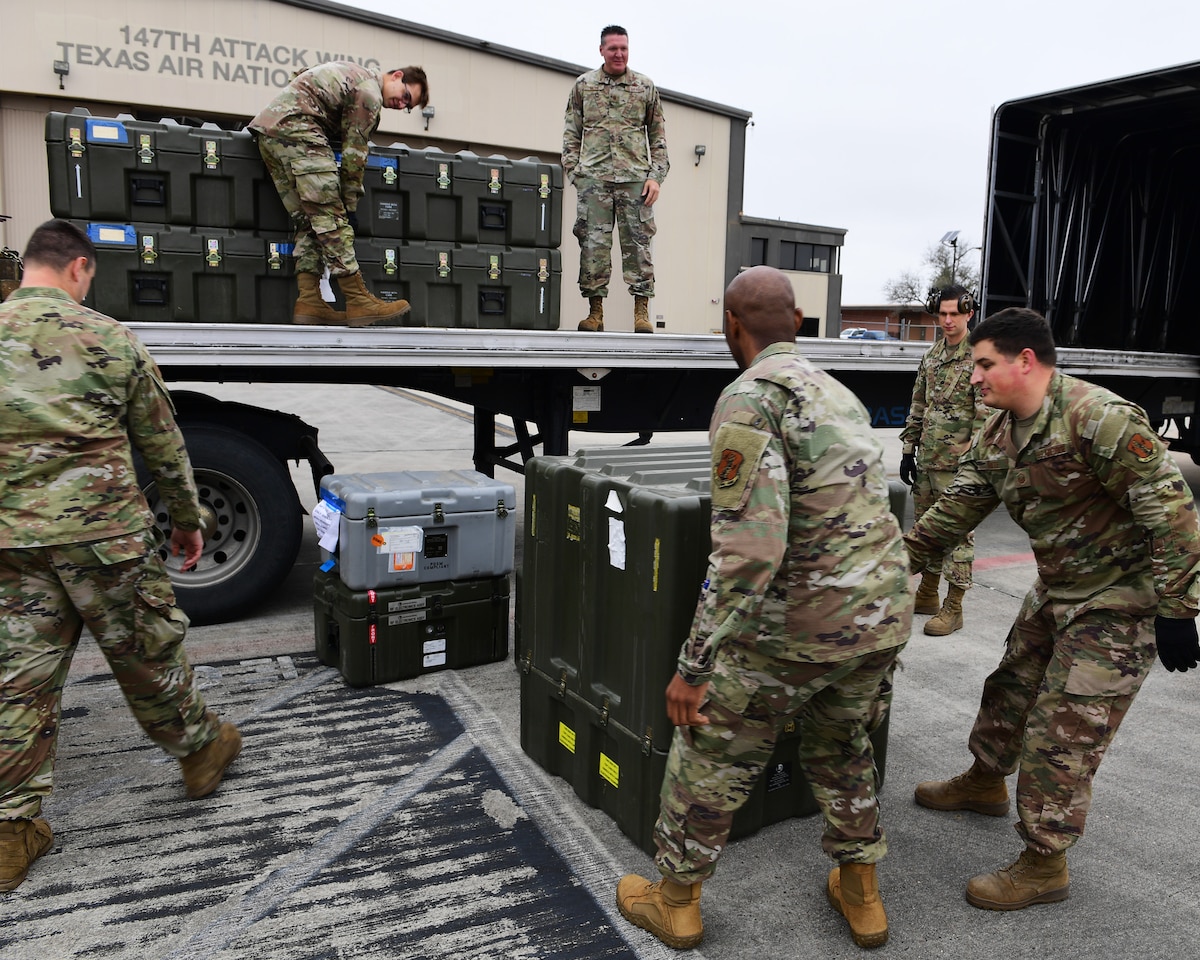 Members of the 147th Attack Wing Aircraft Maintenance Squadron unload a Block 5 MQ-9 Reaper at Ellington Field Joint Reserve Base in Houston, Texas, Dec. 21, 2023. The Block 5 Reaper will ensure the wing remains a formidable force in the ever-changing landscape of modern warfare.