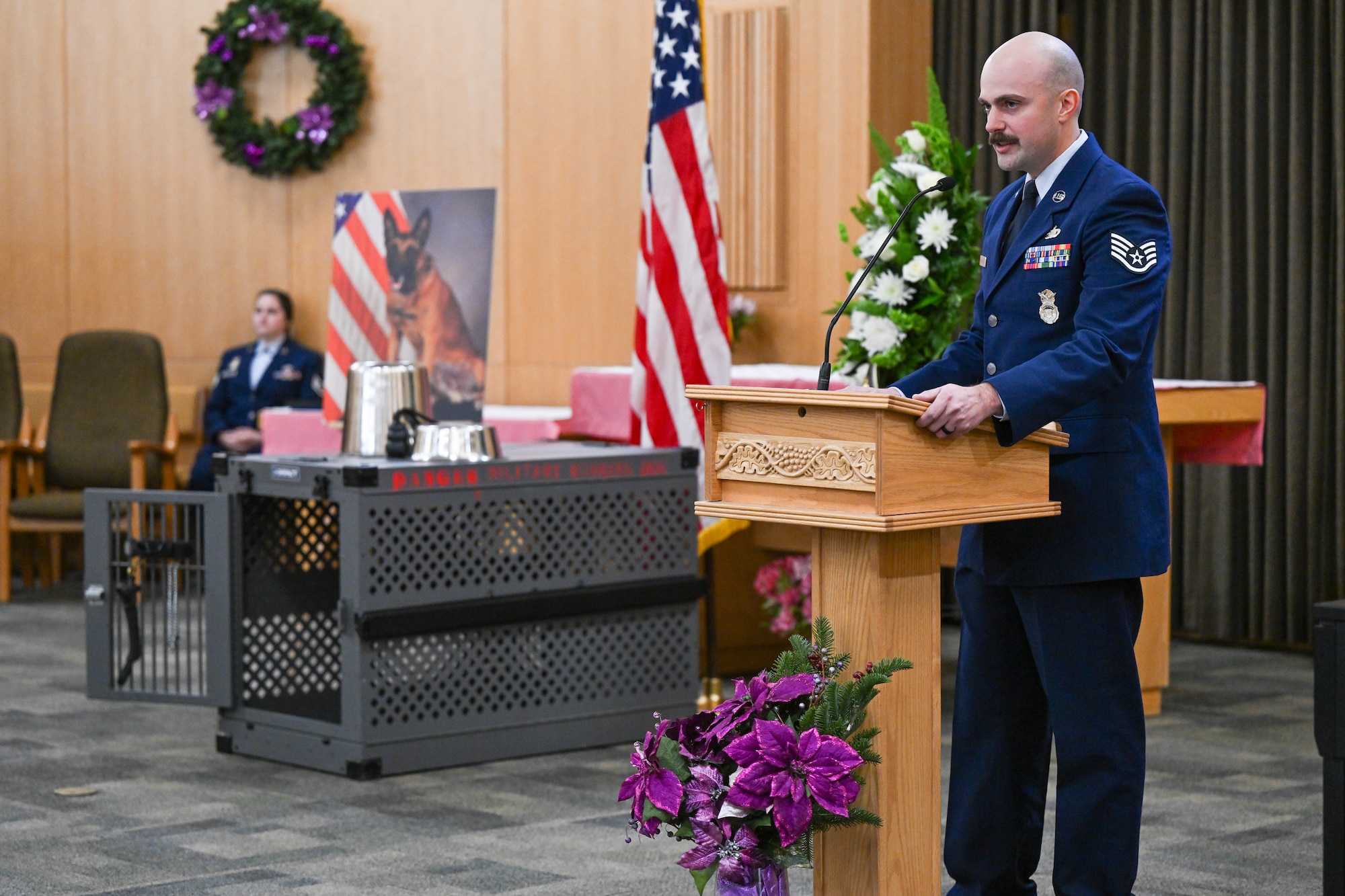 Staff Sgt. Daniel Duarte, 75th Security Forces Squadron K-9 trainer, speaks at the memorial service for military working dog Xxuthus