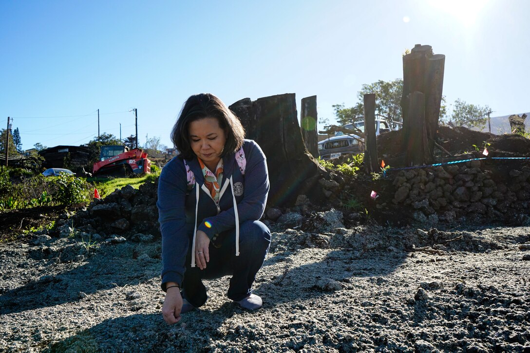 U.S. Rep. Jill Tokuda, Hawaii 2nd Congressional District touched the recently sprayed hydroseed, during her visit to Kula, HI, where 17 homes were destroyed in the Hawaii Wildfires, Aug. 8, 2023.
