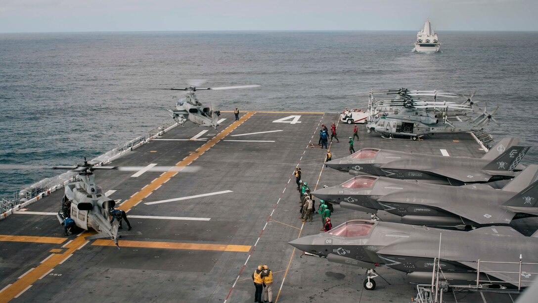 A U.S. Marine Corps AH-1Z Viper attached to Marine Medium Tiltrotor Squadron (VMM) 165 (Reinforced), 15th Marine Expeditionary Unit, lands on the flight deck of the amphibious assault ship USS Boxer (LHD 4) after providing security from the air during an integrated live-fire exercise, Dec. 12, 2023. The 15th MEU is currently embarked aboard the Boxer Amphibious Ready Group conducting integrated training and routine operations in U.S. 3rd Fleet. (U.S. Marine Corps photo by Gunnery Sgt. Donald Holbert)