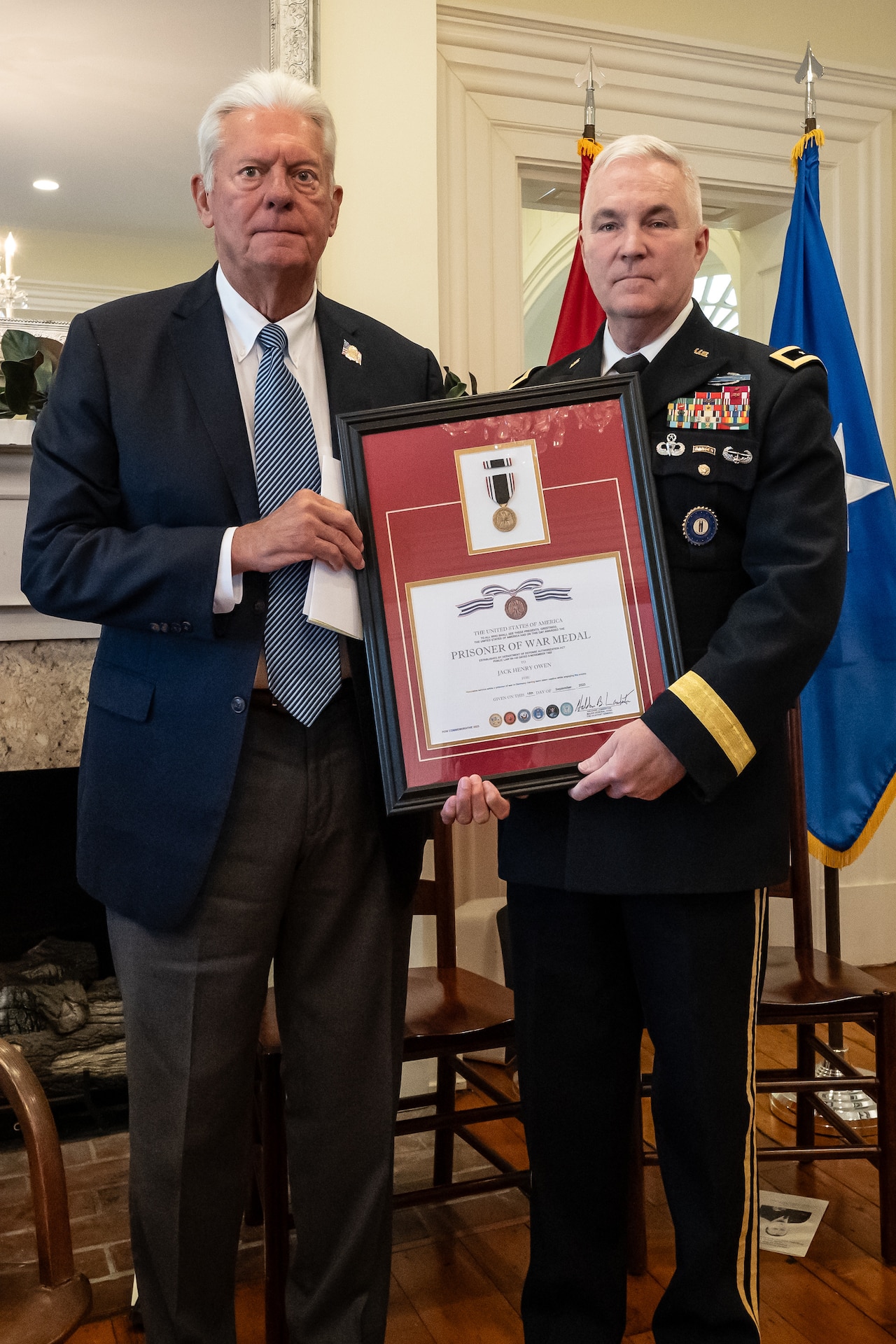 U.S. Army Maj. Gen. Haldane Lamberton, right, adjutant general of the Kentucky National Guard, presents a posthumous Prisoner of War Medal to Sterling P. Owen IV on behalf of Owen’s late uncle, U.S. Air Force Brig. Gen. Jack Henry Owen, during a ceremony in Cynthiana, Ky., Nov. 13, 2023. General Owen, who served in the Kentucky Air National Guard for more than 24 years, rising to become assistant adjutant general for Air, was piloting a B-17 Flying Fortress over Hamburg, Germany, on July 25, 1943, when the aircraft was shot down. He and his crewmen safely parachuted to the ground but were captured by German forces, and Owen remained a POW for the duration of World War II. (U.S. Air National Guard photo by Dale Greer)