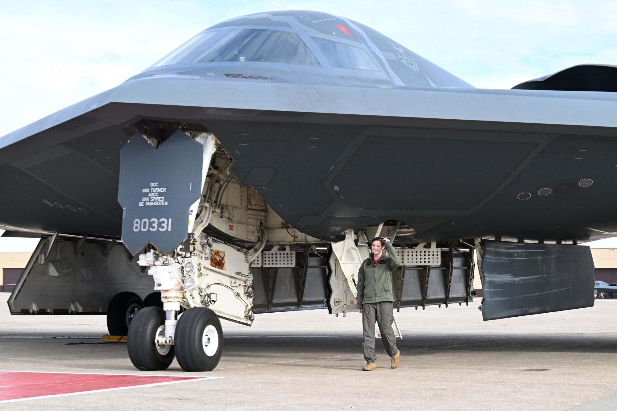 U.S. Air Force Capt. Janel Campbell, 13th Bomb Squadron B-2 pilot, Spirit 823, disembarked from a B-2 Spirit stealth bomber at Whiteman Air Force Base, Mo., Dec. 15, 2023. After completing their training, B-2 pilots take their first flight in the stealth bomber and receive their Spirit number. (U.S. Air Force photo by Airman 1st Class Matthew S. Domingos)