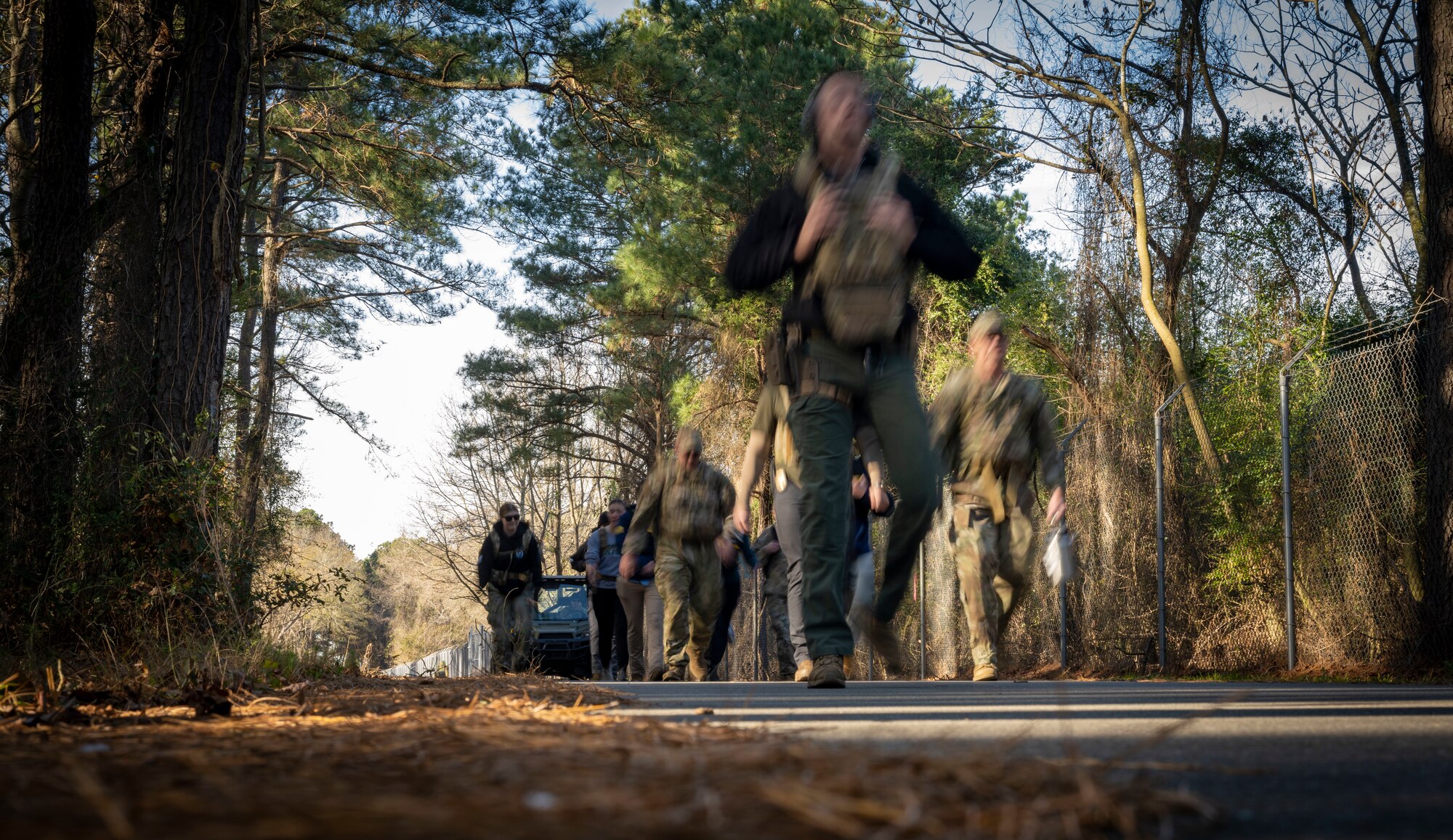U.S. Airmen assigned to the 4th Security Forces Squadron and Office of Special Investigations Detachment 216 participate in a Hustler 6 memorial ruck at Seymour Johnson Air Force Base, North Carolina on Dec 21, 2023.This annual event honors four OSI special agents and two Security Forces defenders that lost their lives during a mission near Bagram, Afghanistan on Dec. 21, 2015. (U.S. Air Force photo by Senior Airman Sabrina Fuller-Judd)