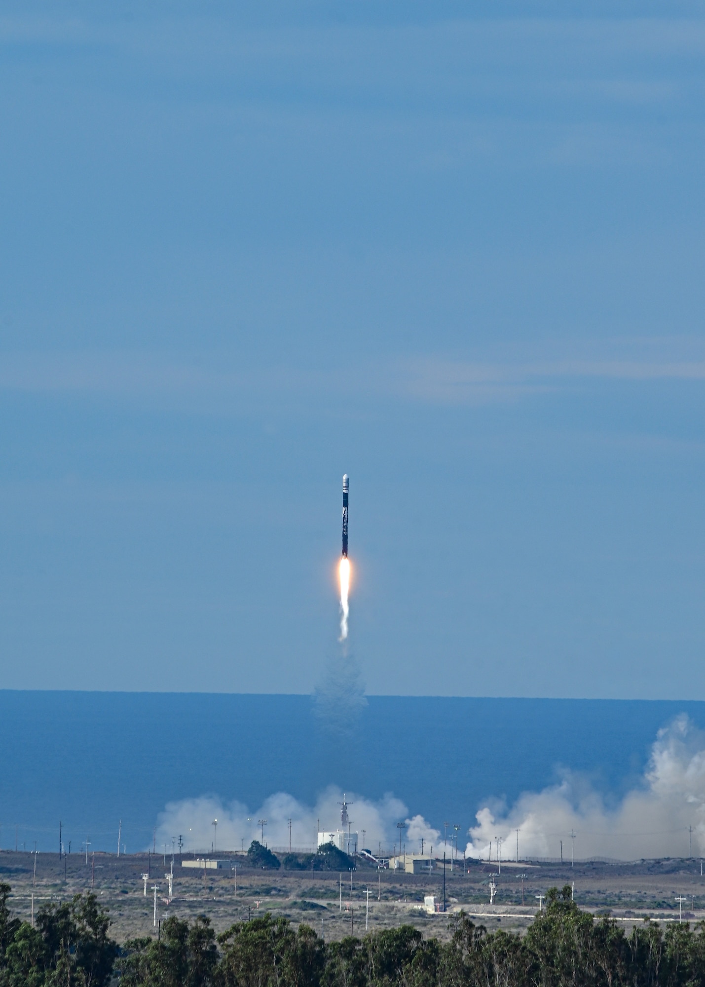 A rocket leaves a launch pad