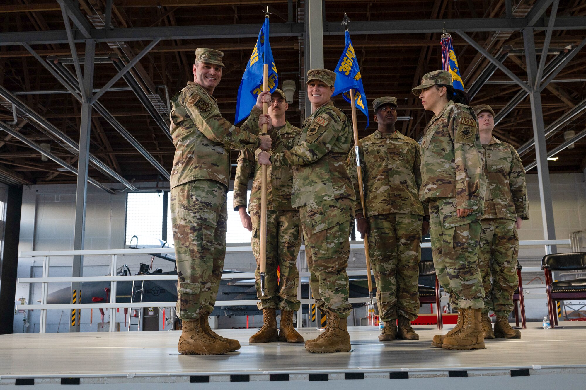 Commander passes the guidon of the squadron
